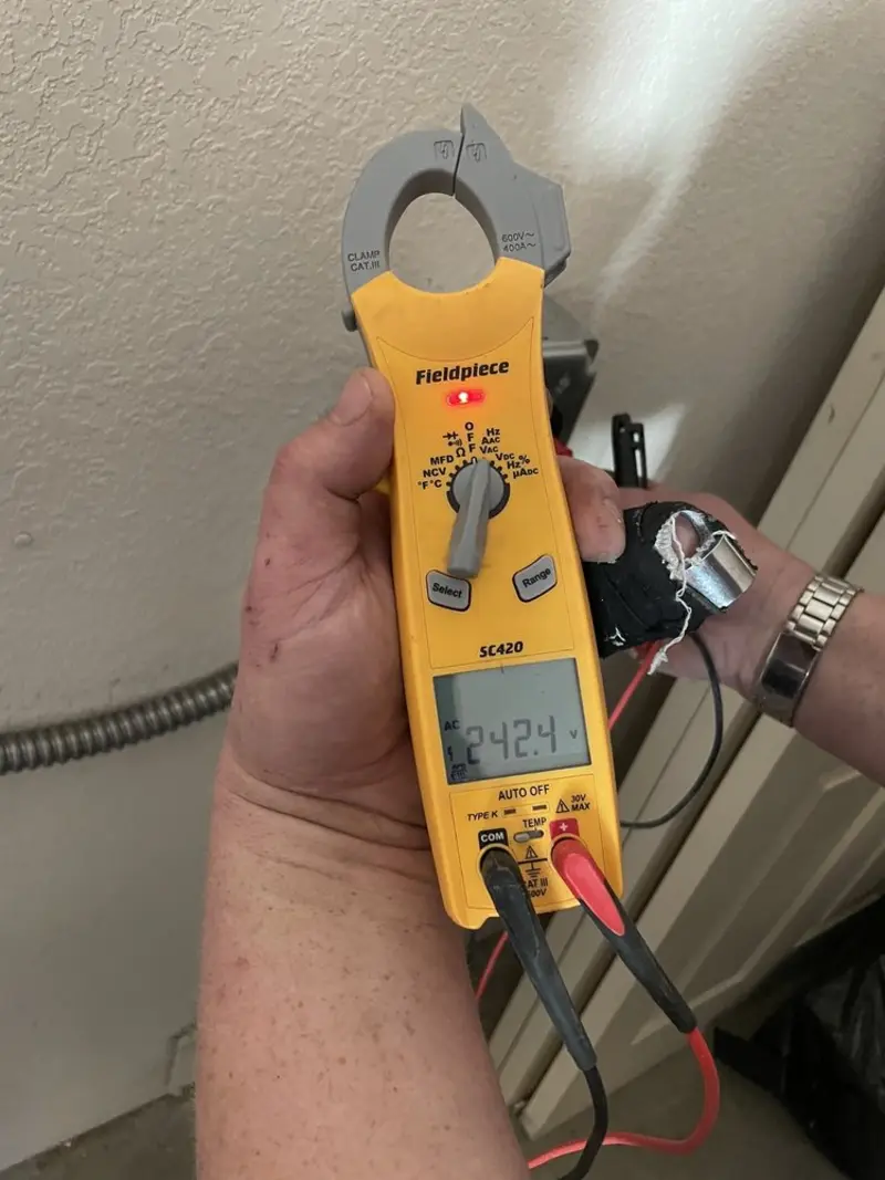 Voltage testing with clamp meter during Aluminum Wiring Replacement in Dayton